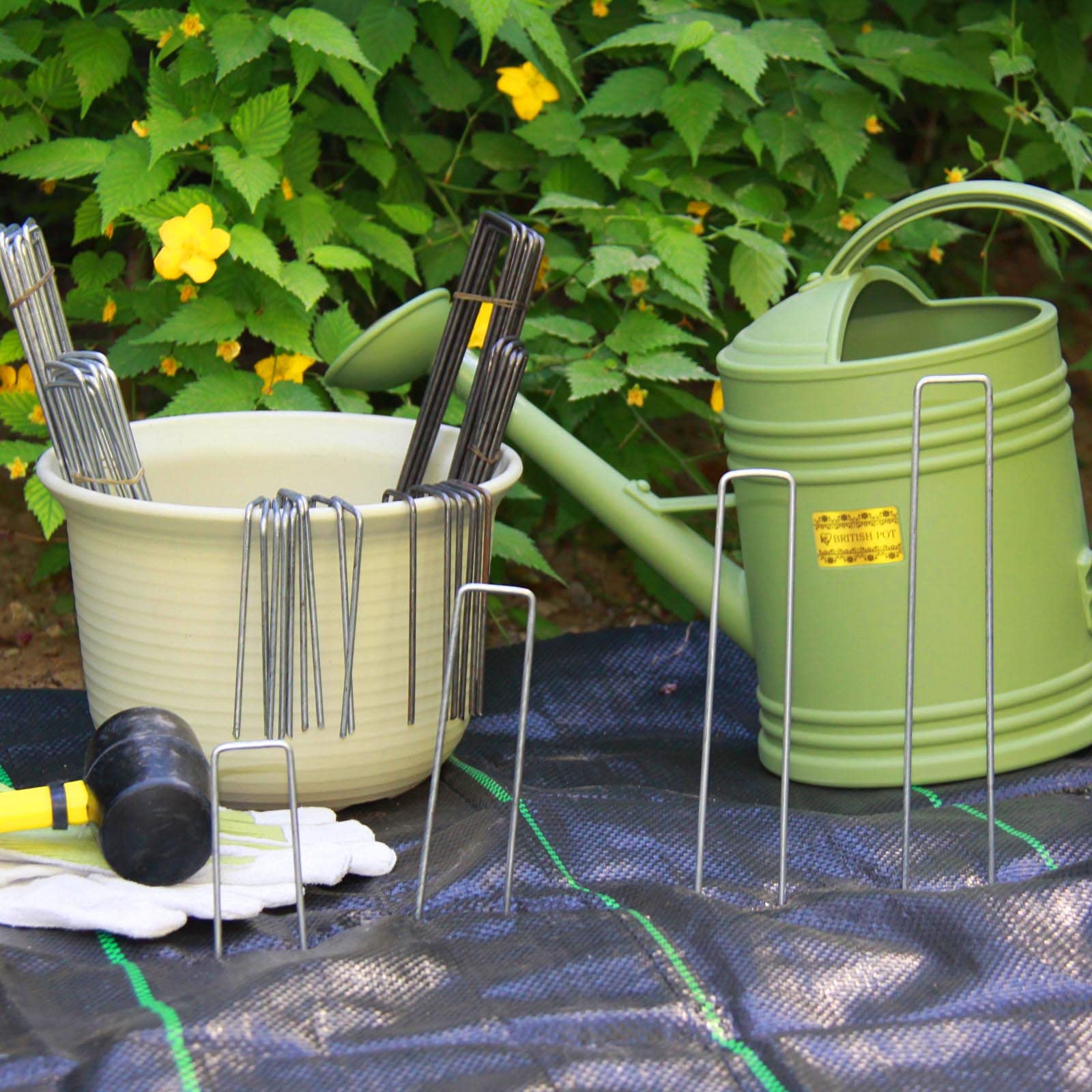 MTB Garden staples pinning landscape fabric to prevent lifting
