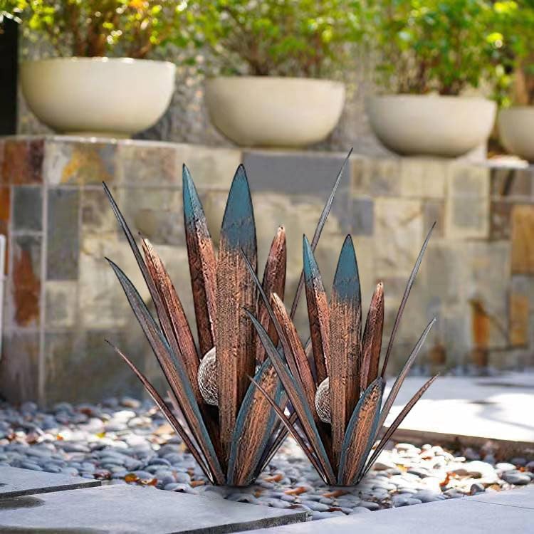 Muciwa agave sculptures placed on lawn creating instant focal point