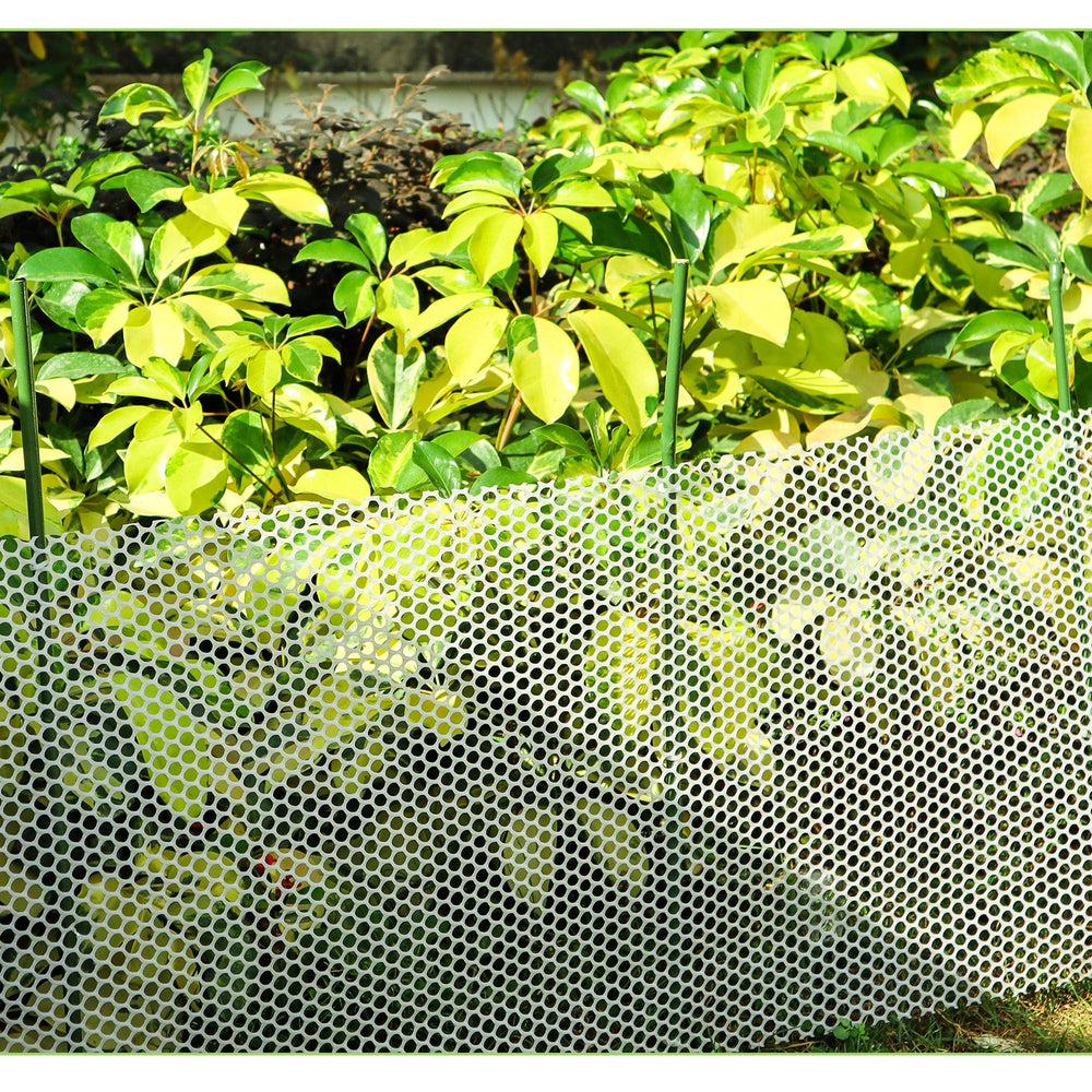 Mulctun stakes in a flower bed creating a natural-looking garden support