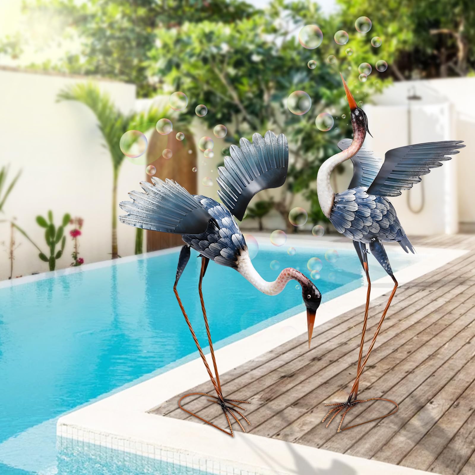 MUMTOP heron beside chair to show size and scale in outdoor setting