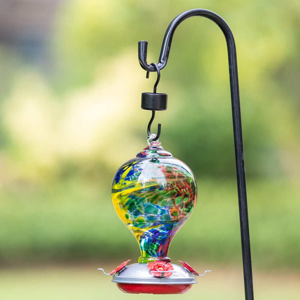 Muse Garden feeders hanging on patio hook attracting hummingbirds in garden