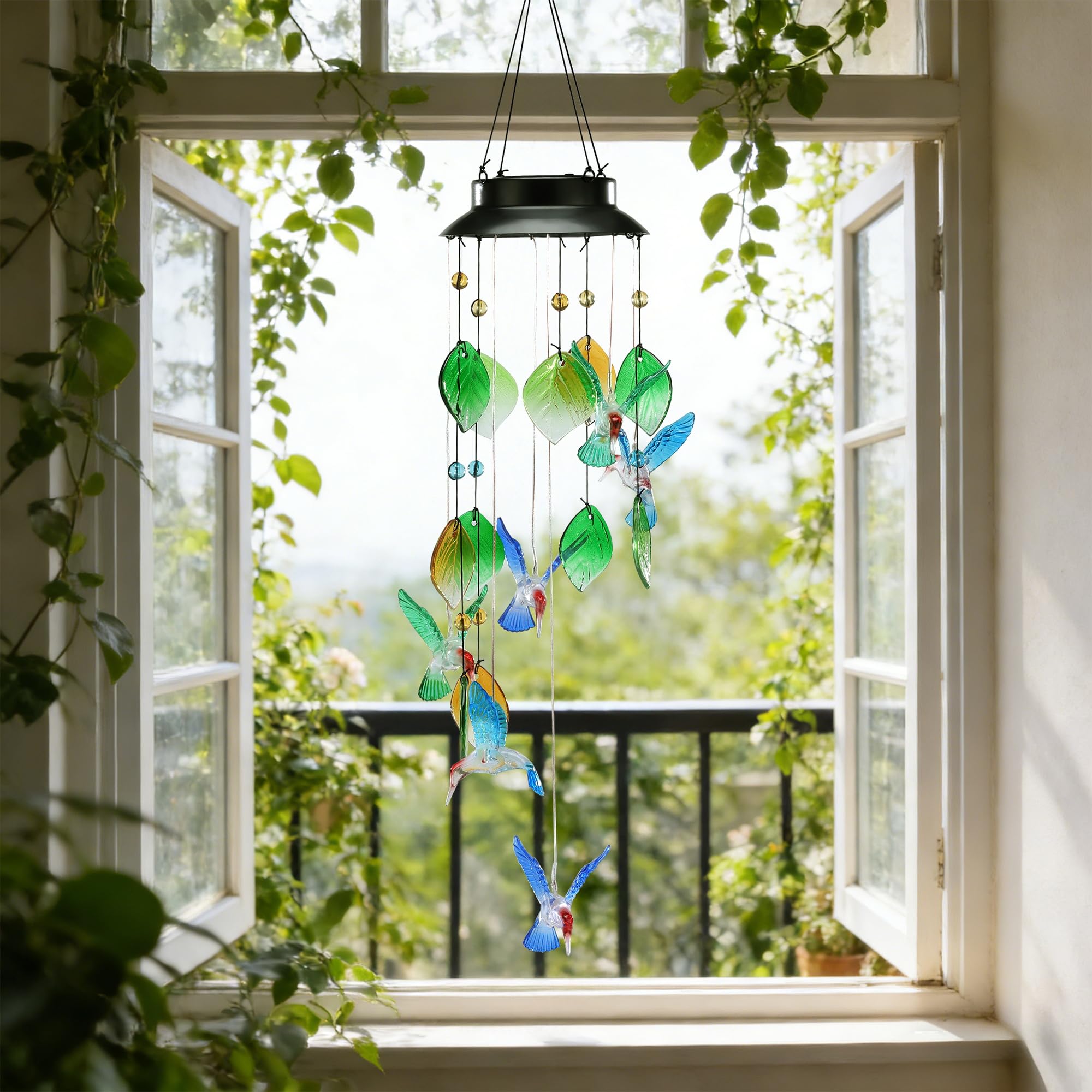 MYCRLIFE wind chime lit at night on patio, warm white glow enhances evening ambiance