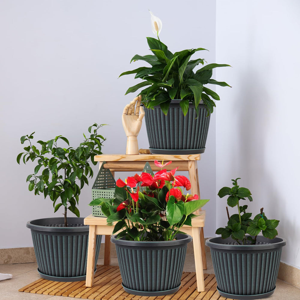 Myfeegoin planters arranged on a patio with mixed plants showing weather-resistant outdoor use benefit