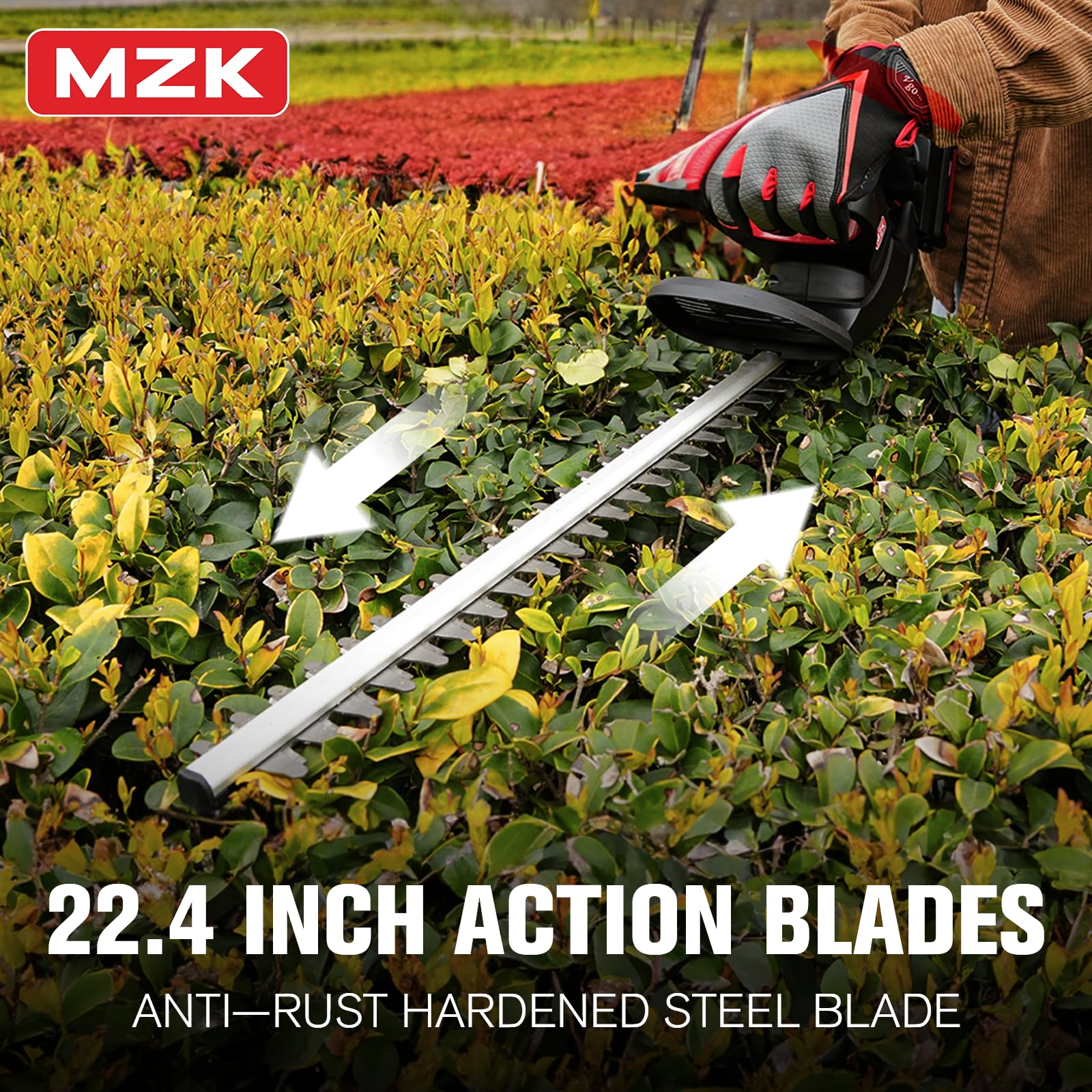 MZK trimmer held by hand next to fence showing lightweight 5-pound maneuverability