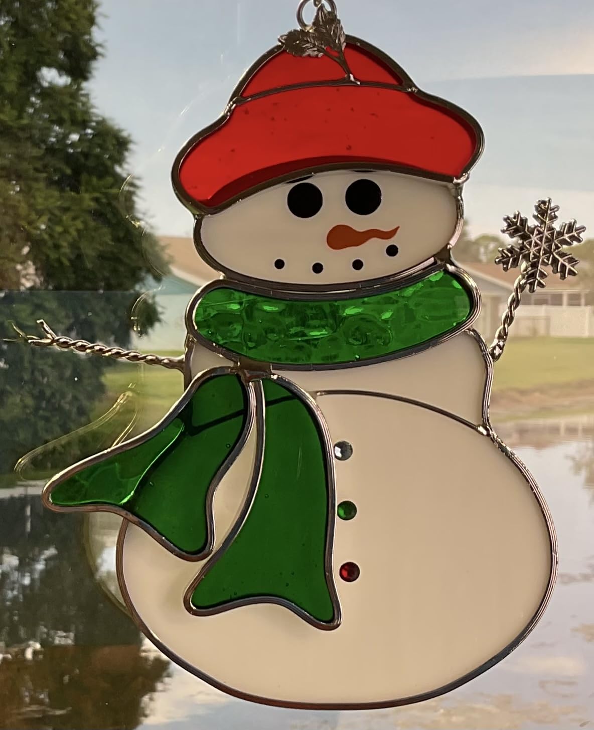 N2 snowman scale on table beside mug showing compact size and decorative impact