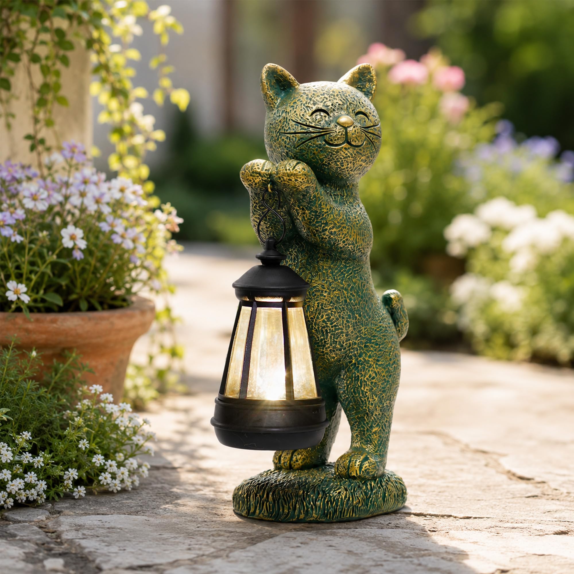 Nacome side profile of cat statue showing stable base and elegant silhouette outdoors