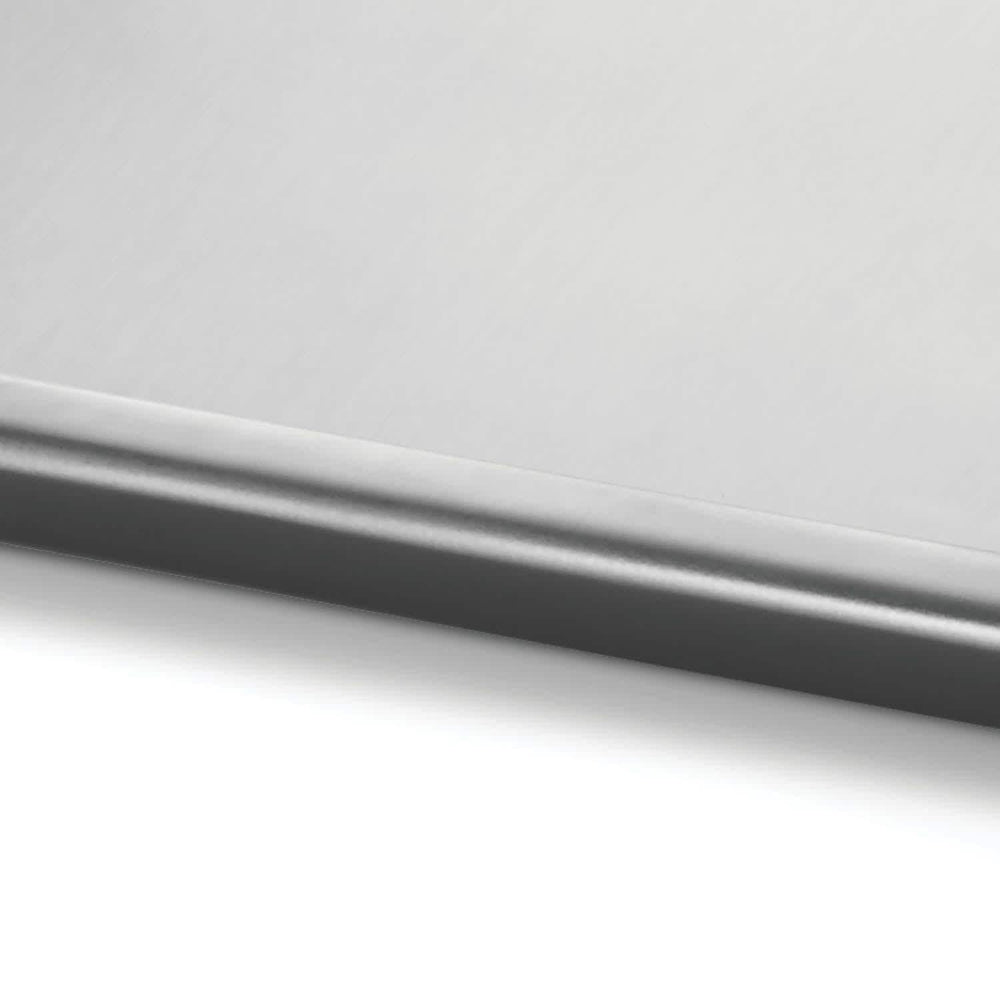Napoleon griddle beside grill tools showing scale and full-size 26 by 16 inch surface