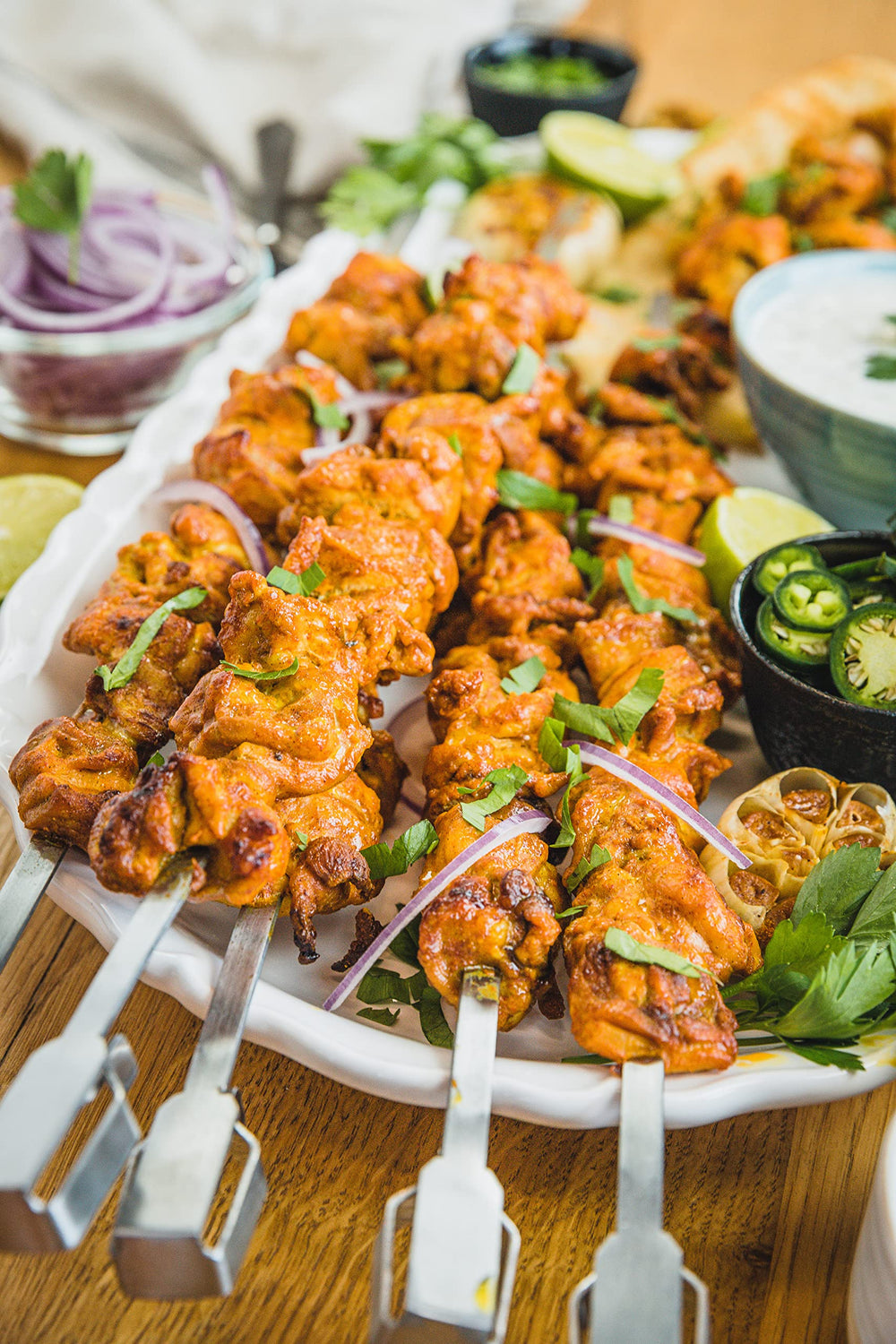 Napoleon lifestyle backyard grill scene showing social grilling and hassle-free kebab serving