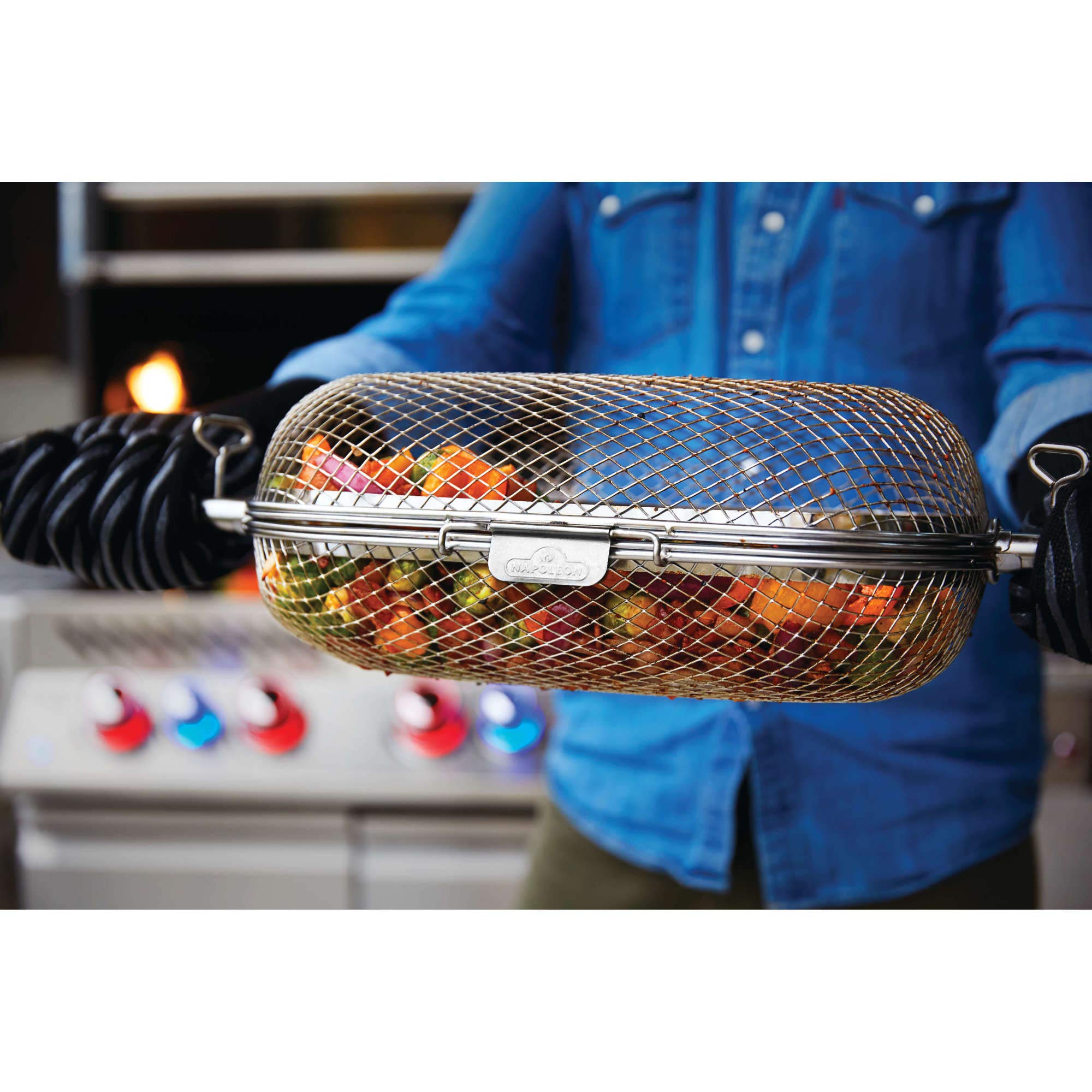 Napoleon rotisserie basket in outdoor grill scene for versatile meal prep