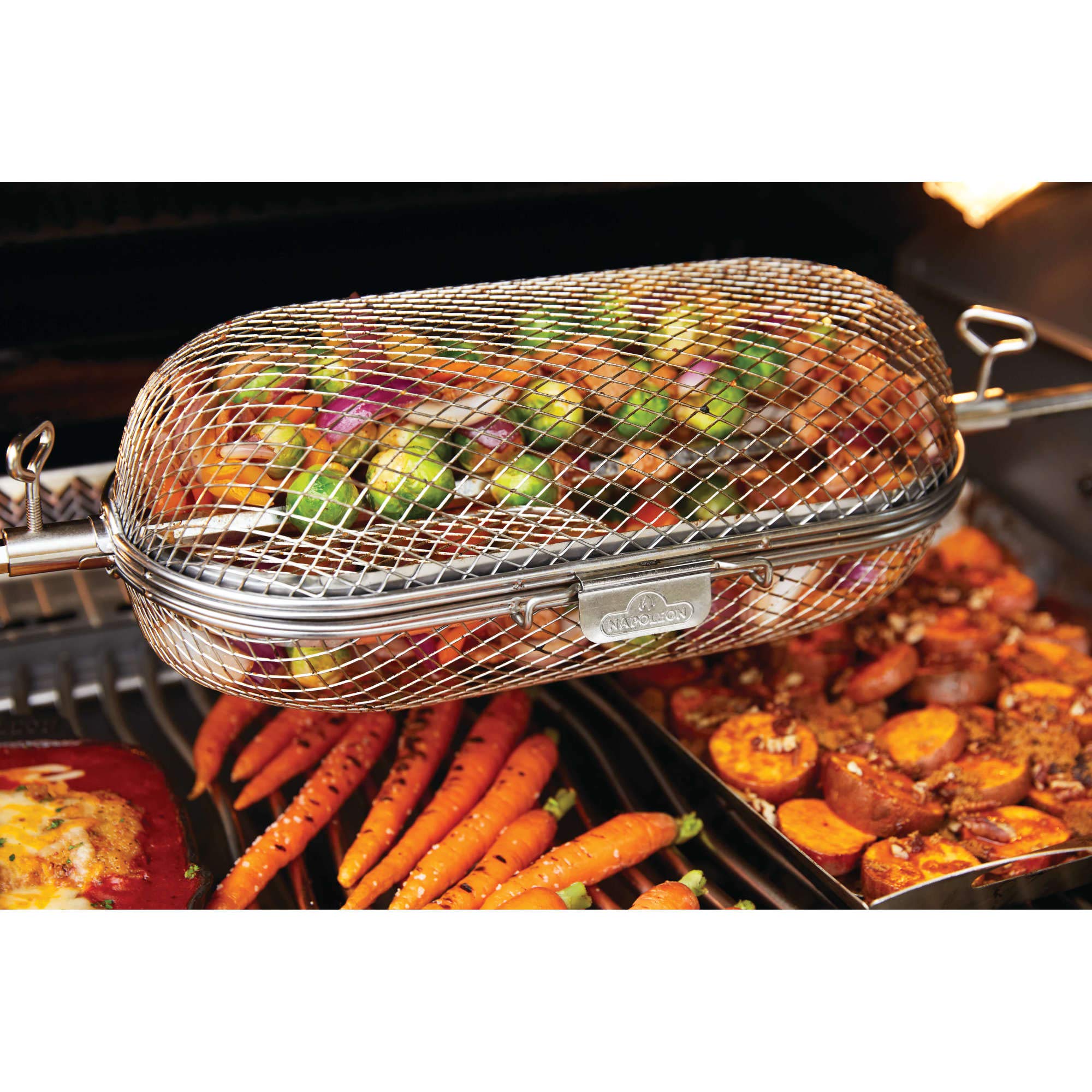 Napoleon rotisserie basket beside ruler to show size and capacity advantage
