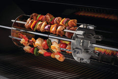 Napoleon rotisserie plates detail showing secure skewer positioning and stable rotation