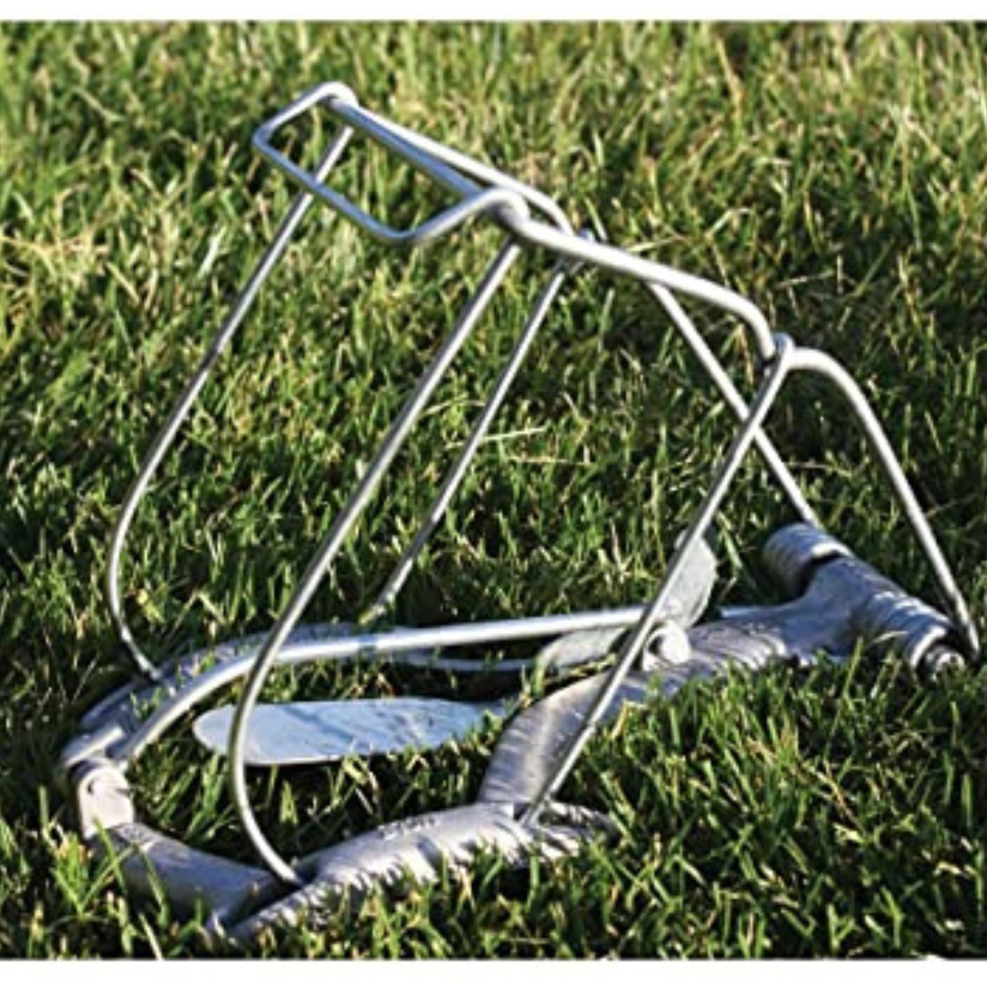 Nash trap installed in turf demonstrating subterranean placement safety
