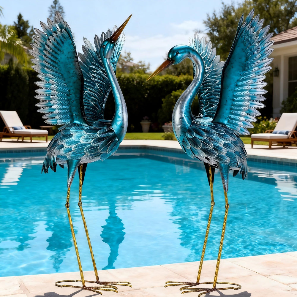 Natelf front view of blue heron statues showing elegant yard focal point