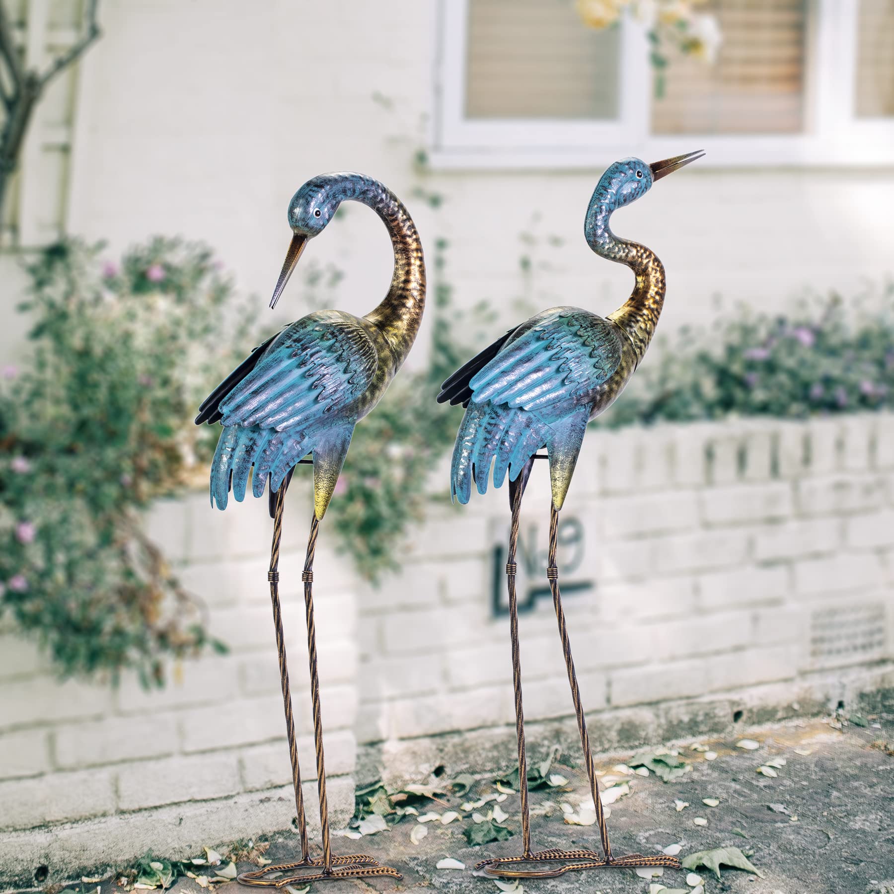 Natelf heron next to gardening tools showing scale and effortless integration