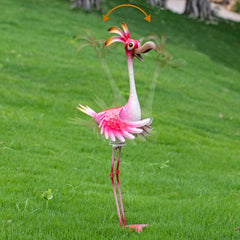 Natelf flamingo placed in garden bed adding colorful focal point