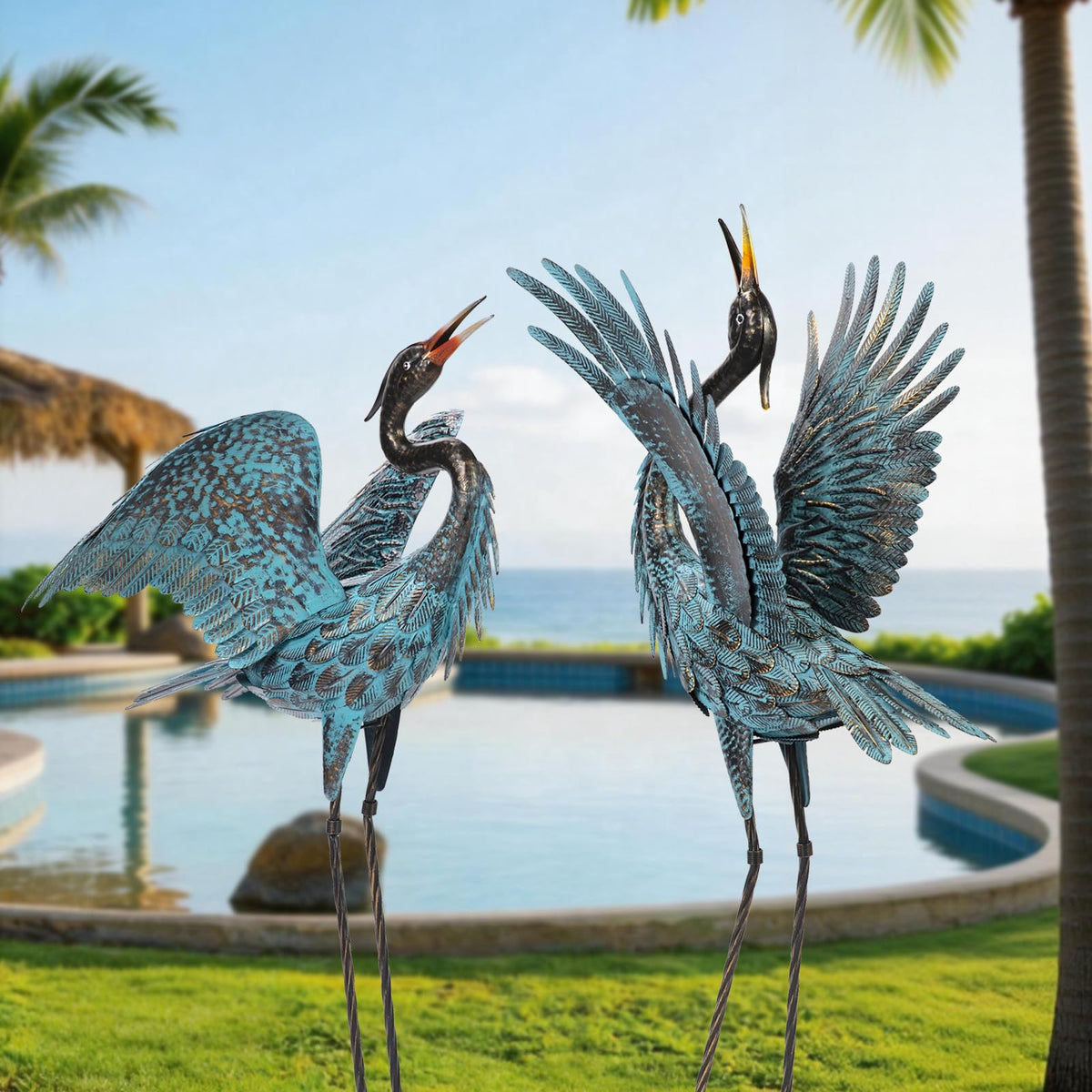 Natelf front view of blue heron pair showing elegant garden focal point
