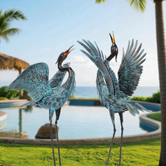 Natelf front view of blue heron pair showing elegant garden focal point