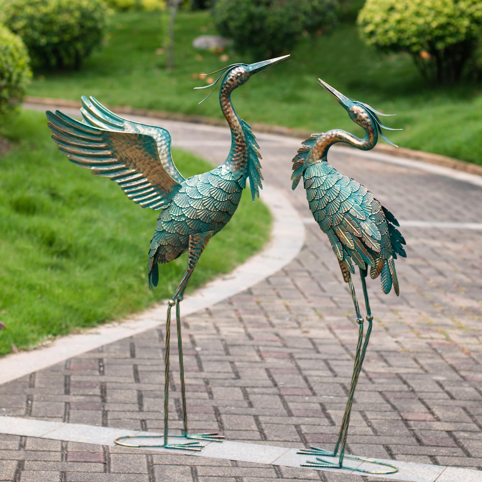Natelf garden pair in flowerbed showing layered composition and charm