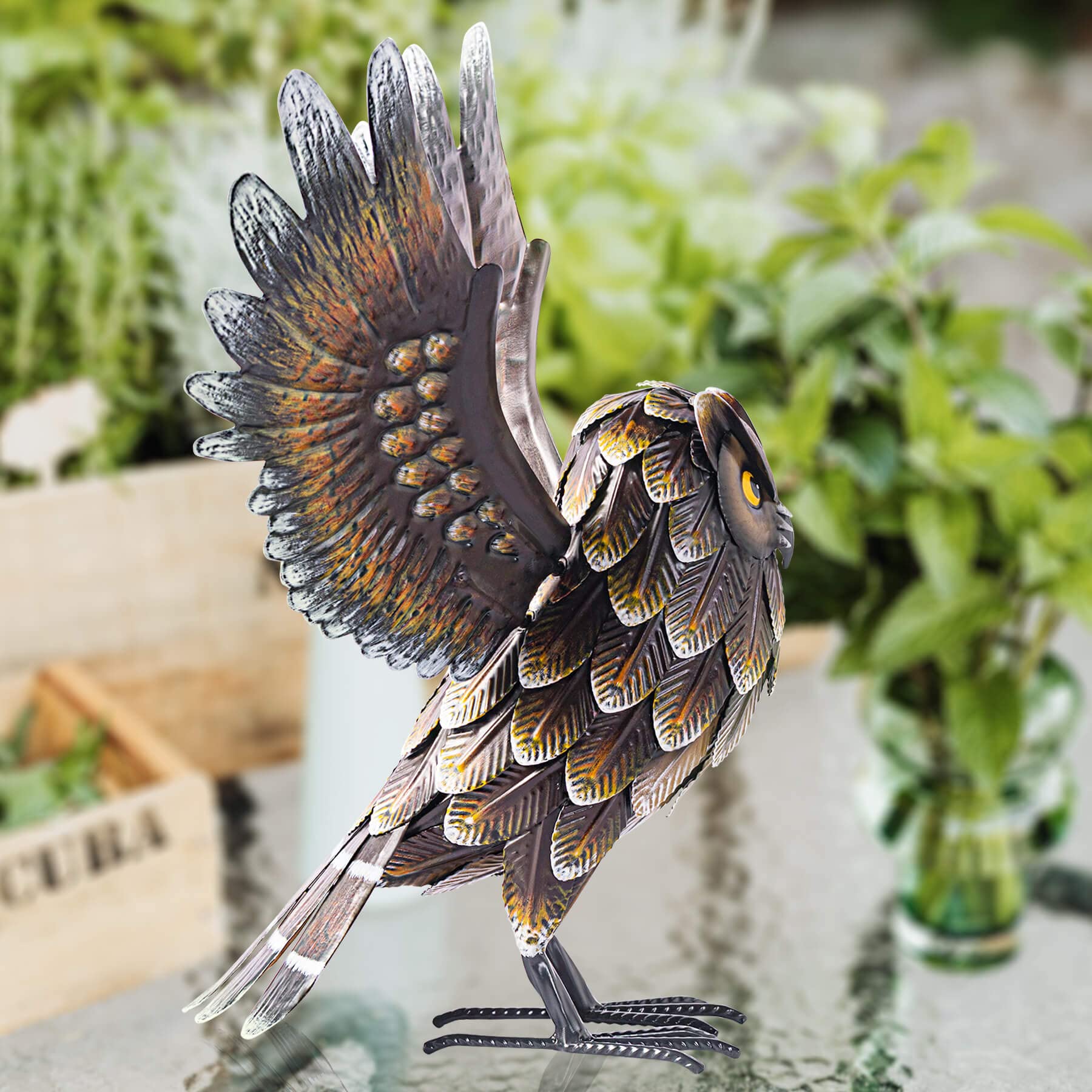 Natelf owl beside pond lifestyle shot enhancing outdoor ambiance