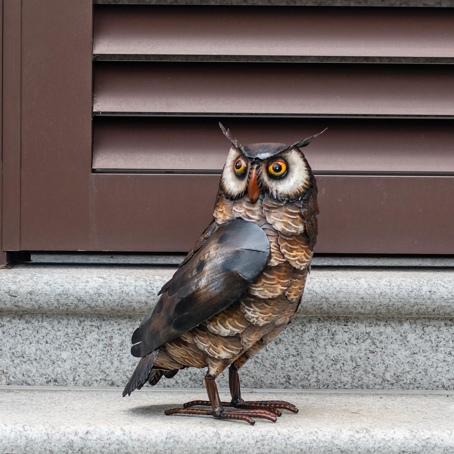 Natelf owl in rain showing weather-resistant finish for lasting outdoor durability
