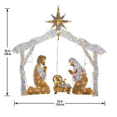 National Tree Company nativity in yard at night showing bright display and curb appeal benefit
