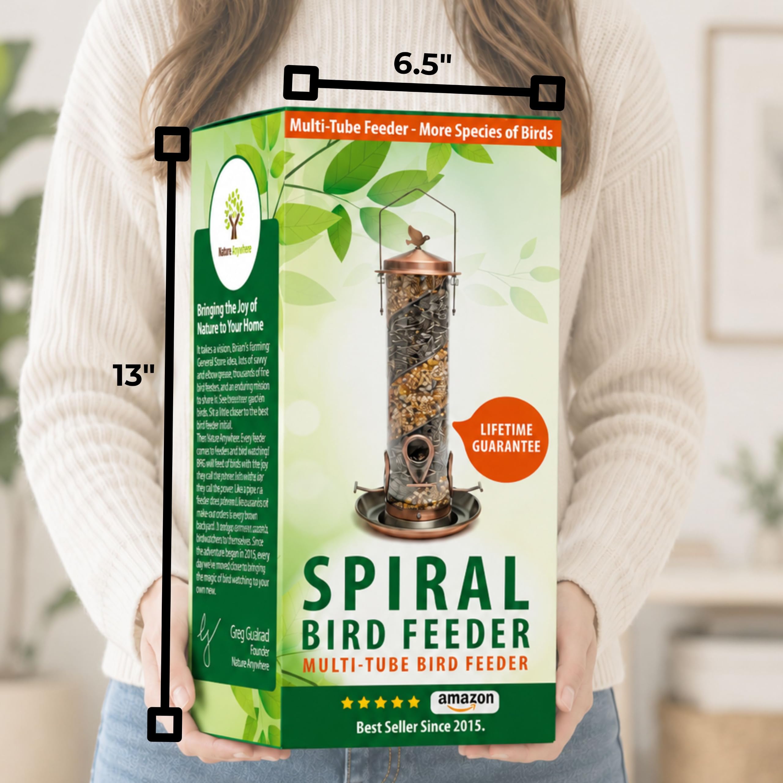 Nature Anywhere feeder beside a hand showing compact size and convenient handling