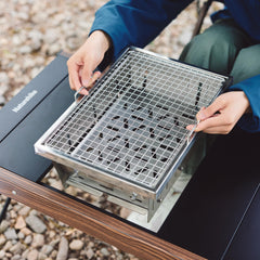 Folded Naturehike grill in carry bag ready to transport for lightweight trips