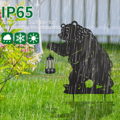 nawaza pair of bear stakes placed in flower bed providing decorative yard lighting