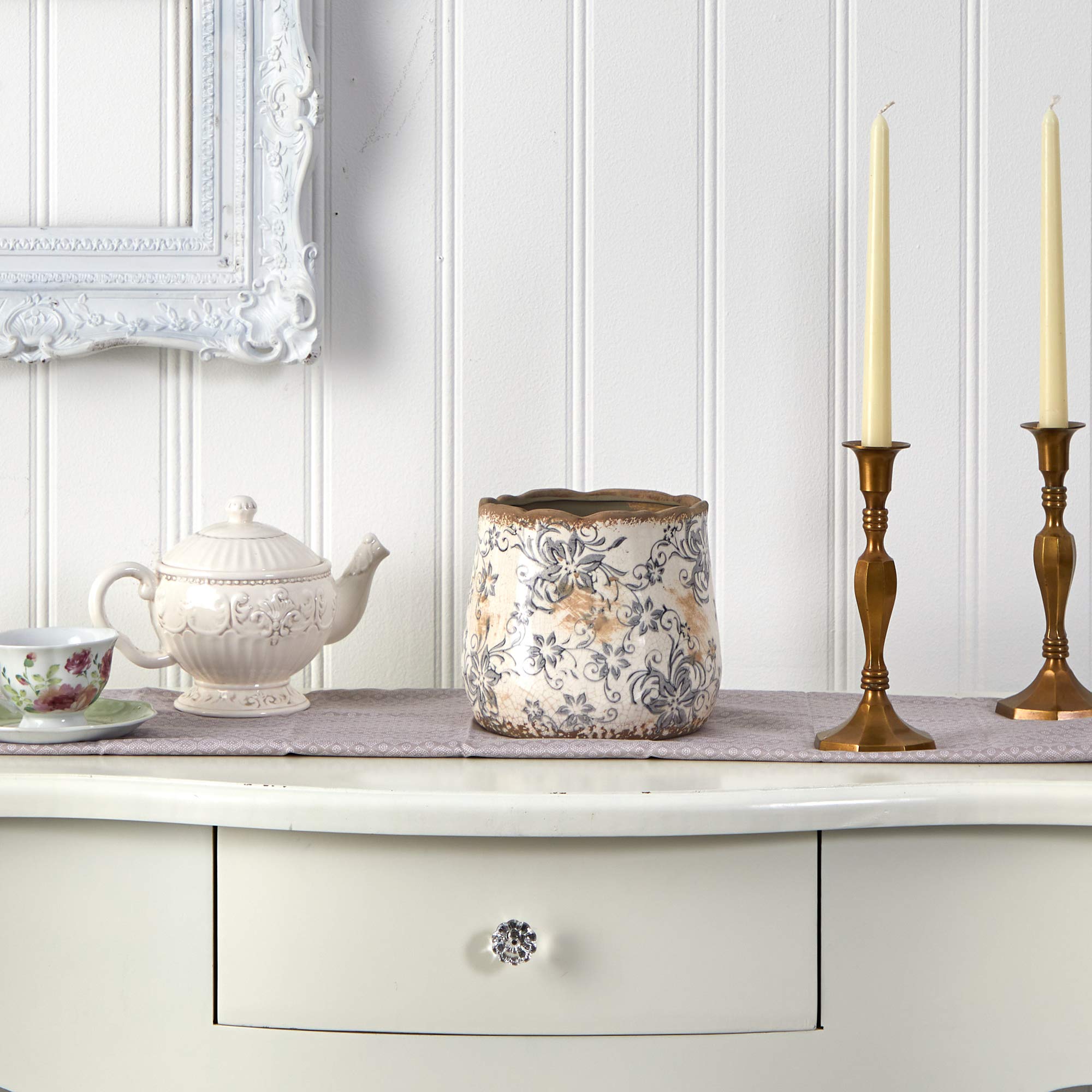 Nearly Natural vase styled on a table with faux flowers, enhancing cozy decor