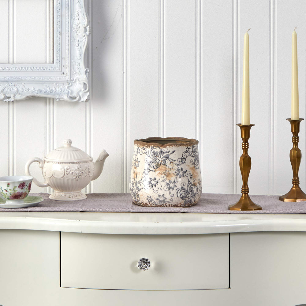Nearly Natural vase styled on a table with faux flowers, enhancing cozy decor