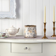 Nearly Natural vase styled on a table with faux flowers, enhancing cozy decor