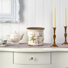 Nearly Natural planter styled with faux flowers on table creating cozy decor