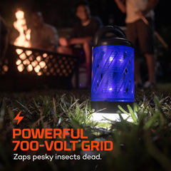 NEBO mini bug zapper lit in lantern mode providing bright campsite illumination