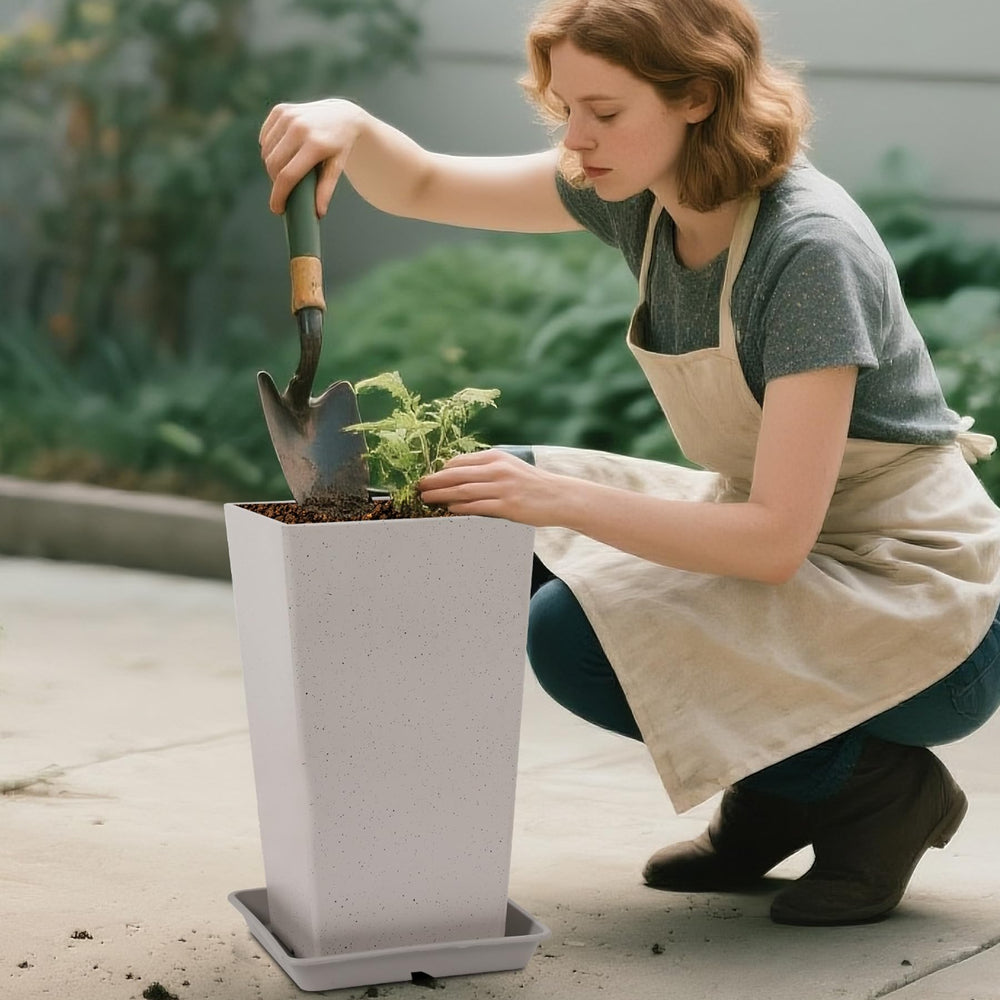 Neoaider grouped planters in landscape illustrating layered planting options