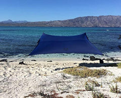 Neso front view of navy canopy showing full shade coverage and portability benefit