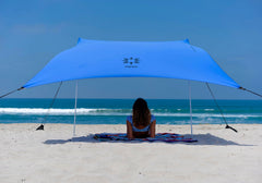 Neso front view periwinkle tent showing full shaded area and easy setup benefit