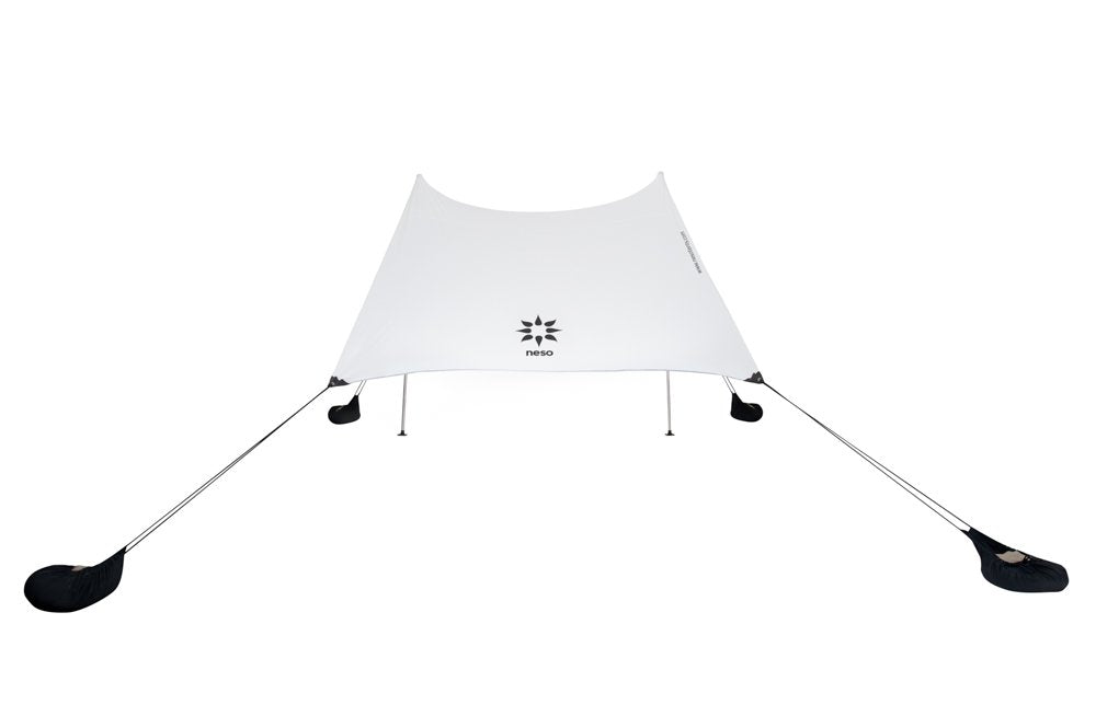 Neso lifestyle picnic by shoreline highlighting portable shade comfort