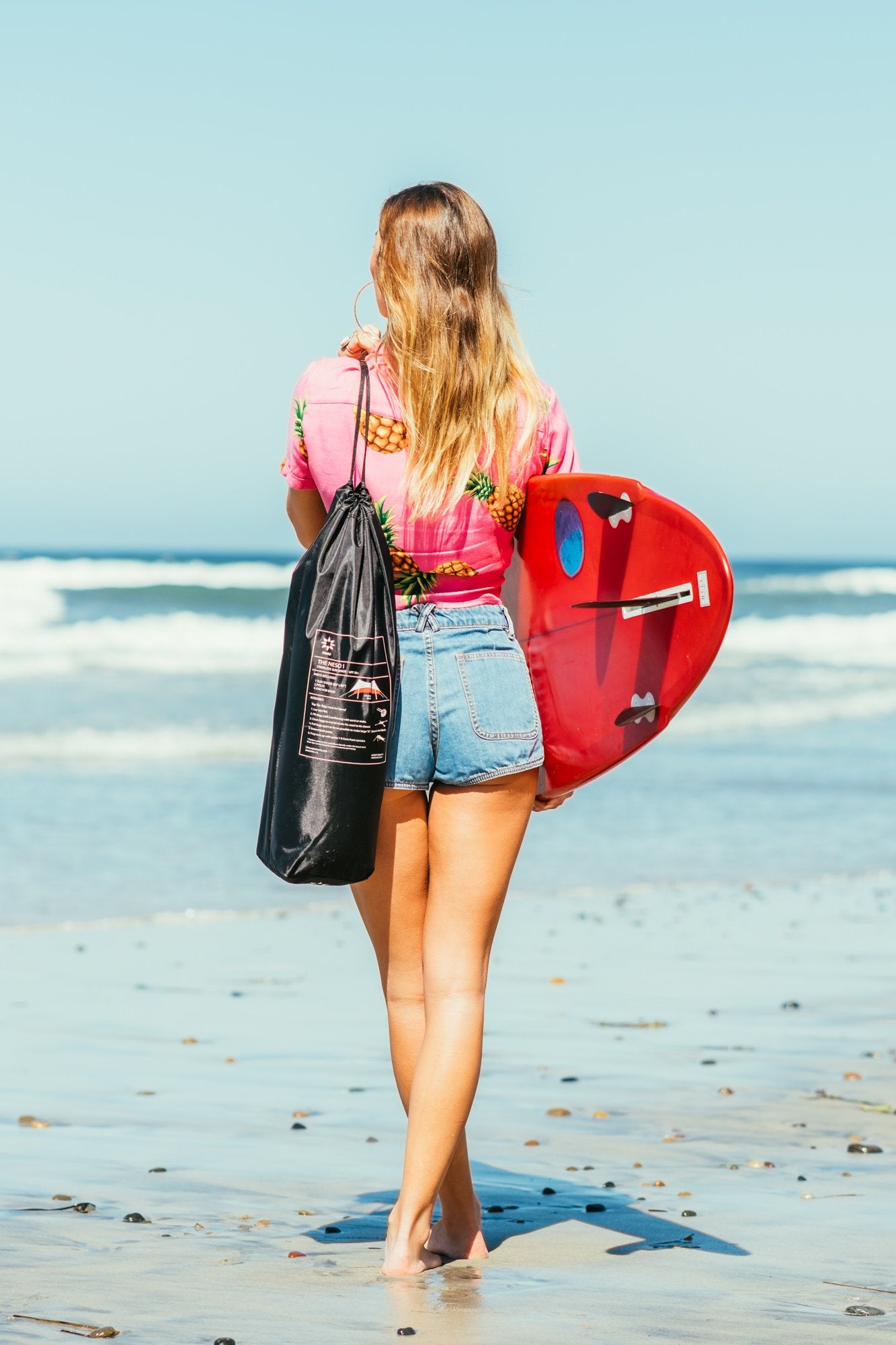 Neso next to beach gear showing 7x7 ft scale and group-shade capacity benefit
