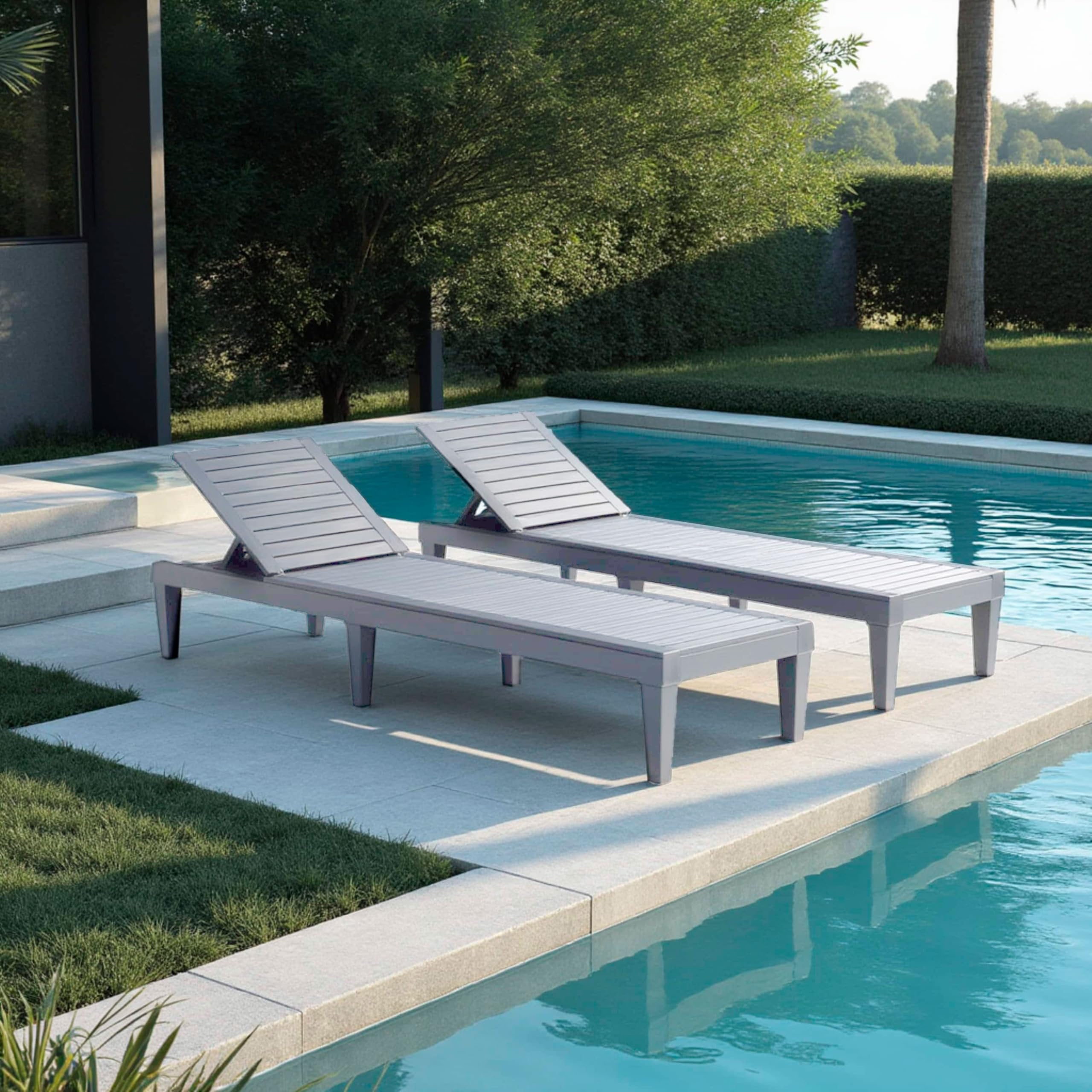 Nestl lounge chair next to person for scale showing generous length and width