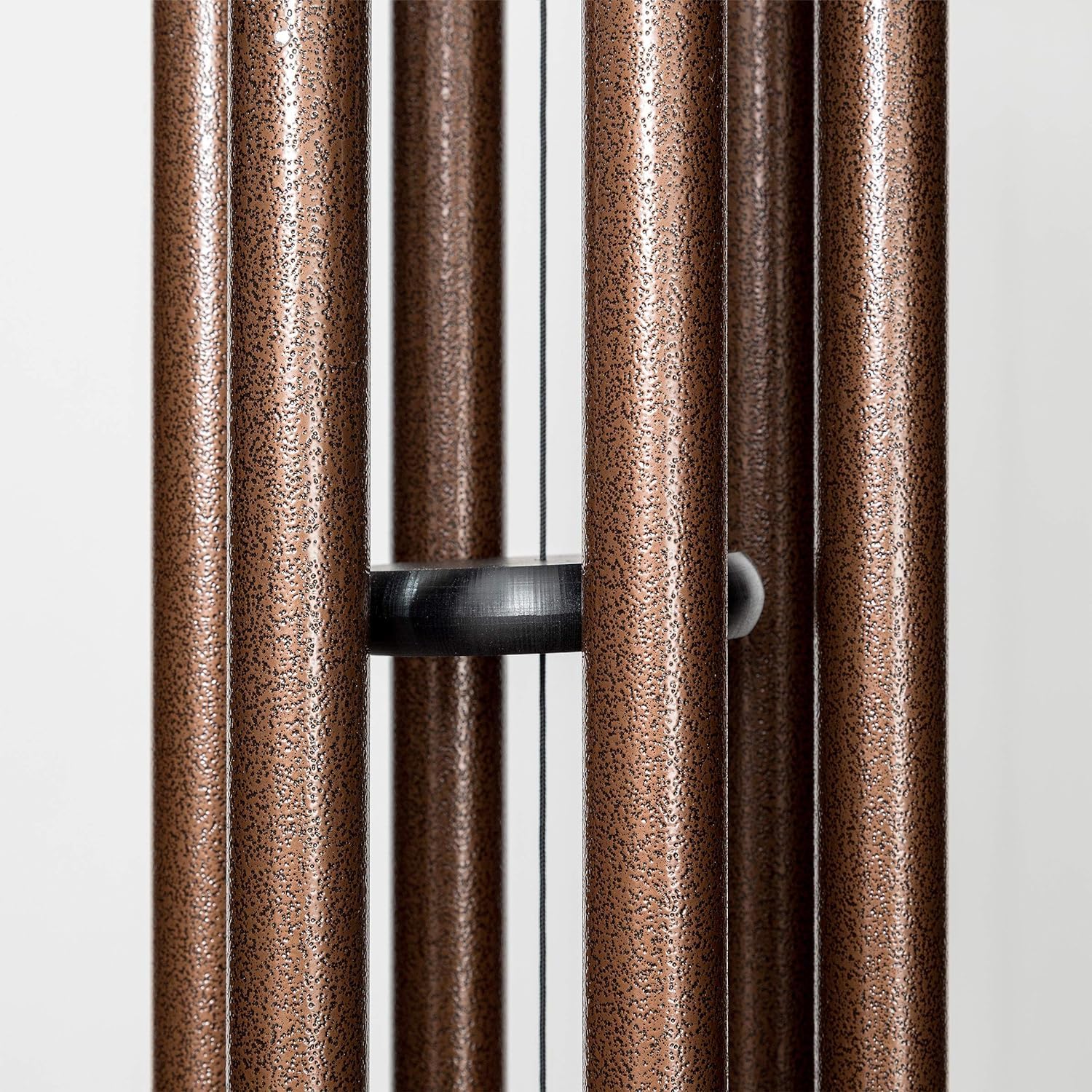 NETAEX wind chime next to chair for size comparison illustrating the 32-inch overall length