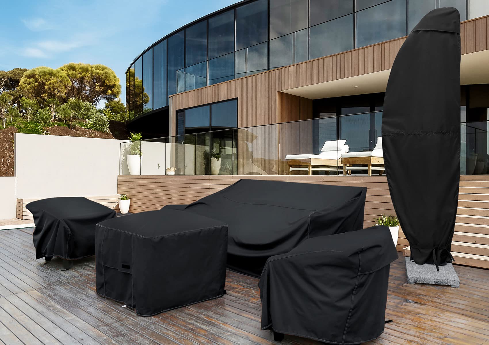 NettyPro cover over patio umbrella in garden setting, protects furnishings