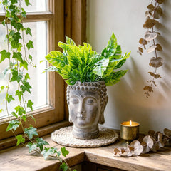 Newman House Studio Buddha head front view showing stone finish and calm decor benefits