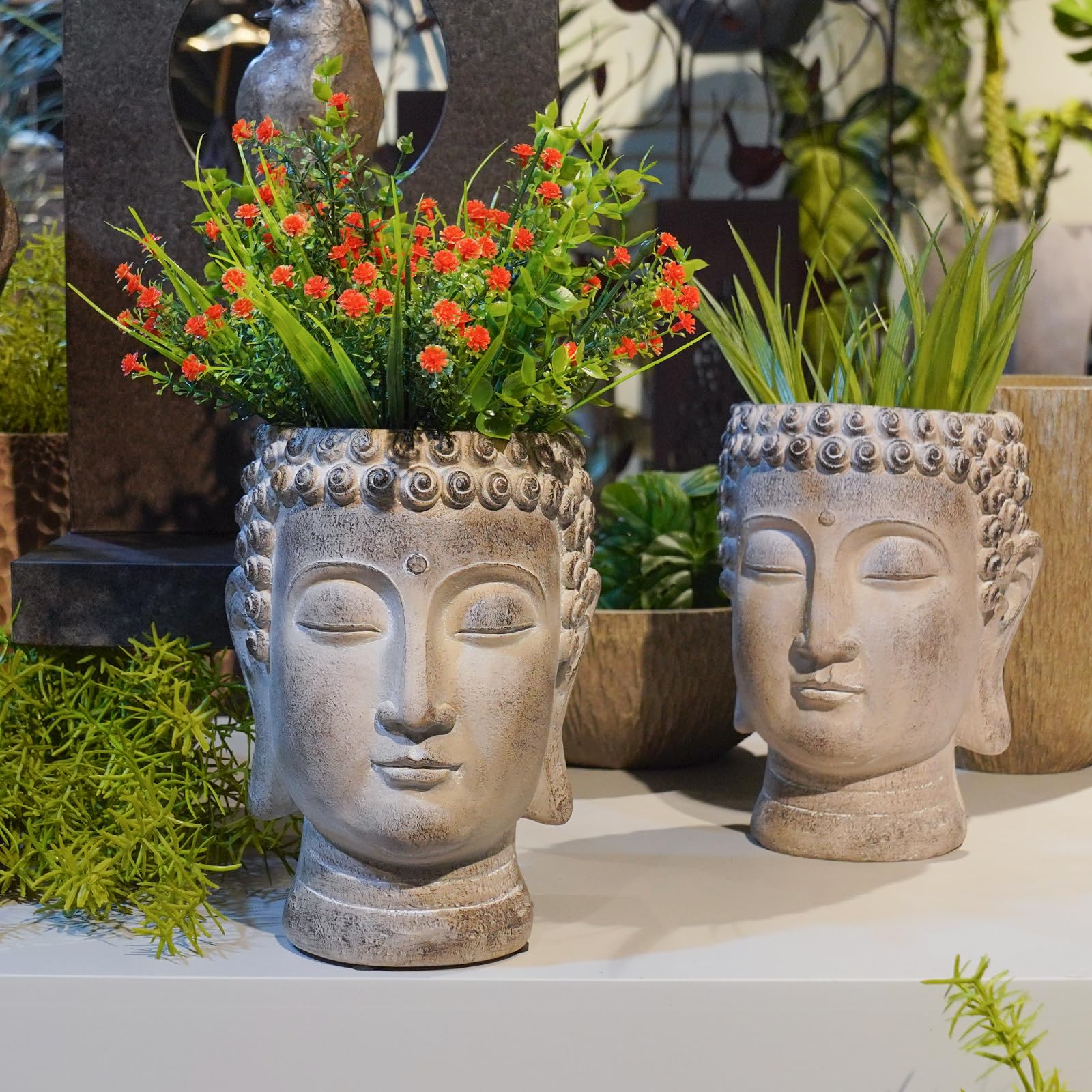 Newman House Studio Buddha planter on patio showing outdoor decor and peaceful ambience benefit