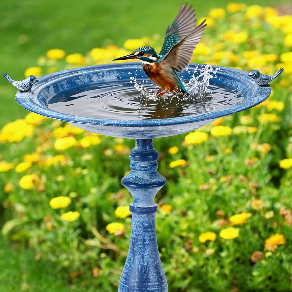 Newtay birdbath next to chair for scale demonstrating compact height ideal for patios