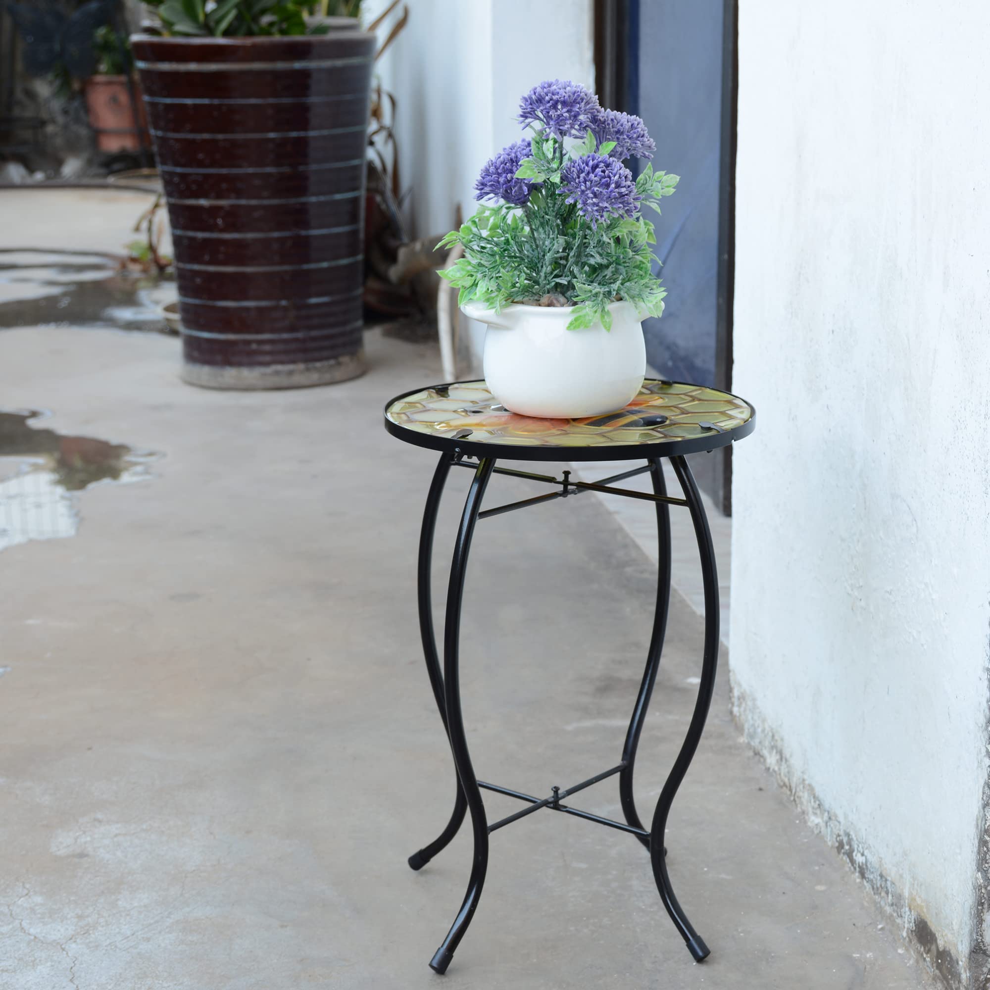 NewVees bee table on patio holding drinks and books, useful poolside accent benefit