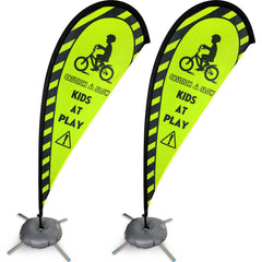 Newwiee front view of green teardrop Kids at Play flag increasing roadside visibility