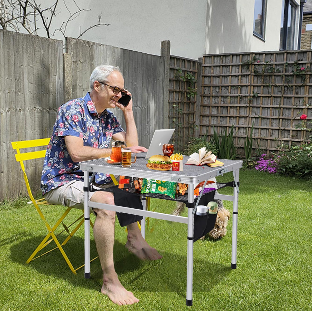 Nice C table used at an outdoor picnic on grass for portable dining