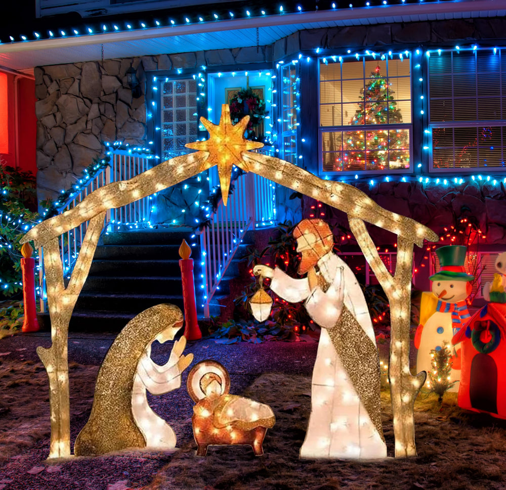 NIGHT-GRING nativity on front lawn with home background demonstrating seasonal atmosphere