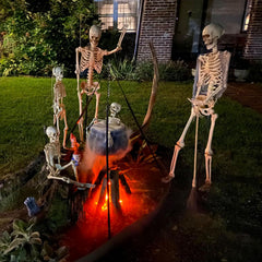NIGHT-GRING lit cauldron at night creating dramatic Halloween glow