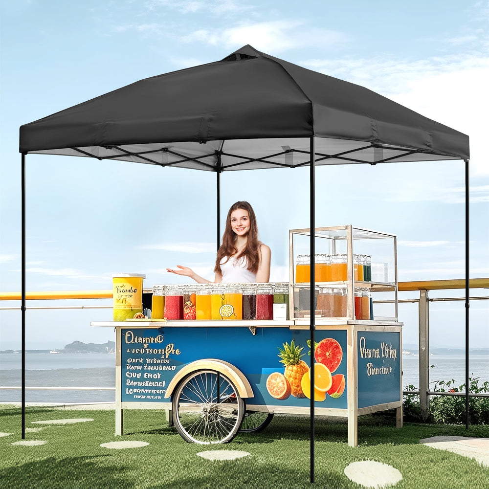 NINAT lifestyle scene with canopy top at an outdoor market emphasizing shaded comfort and professional appearance